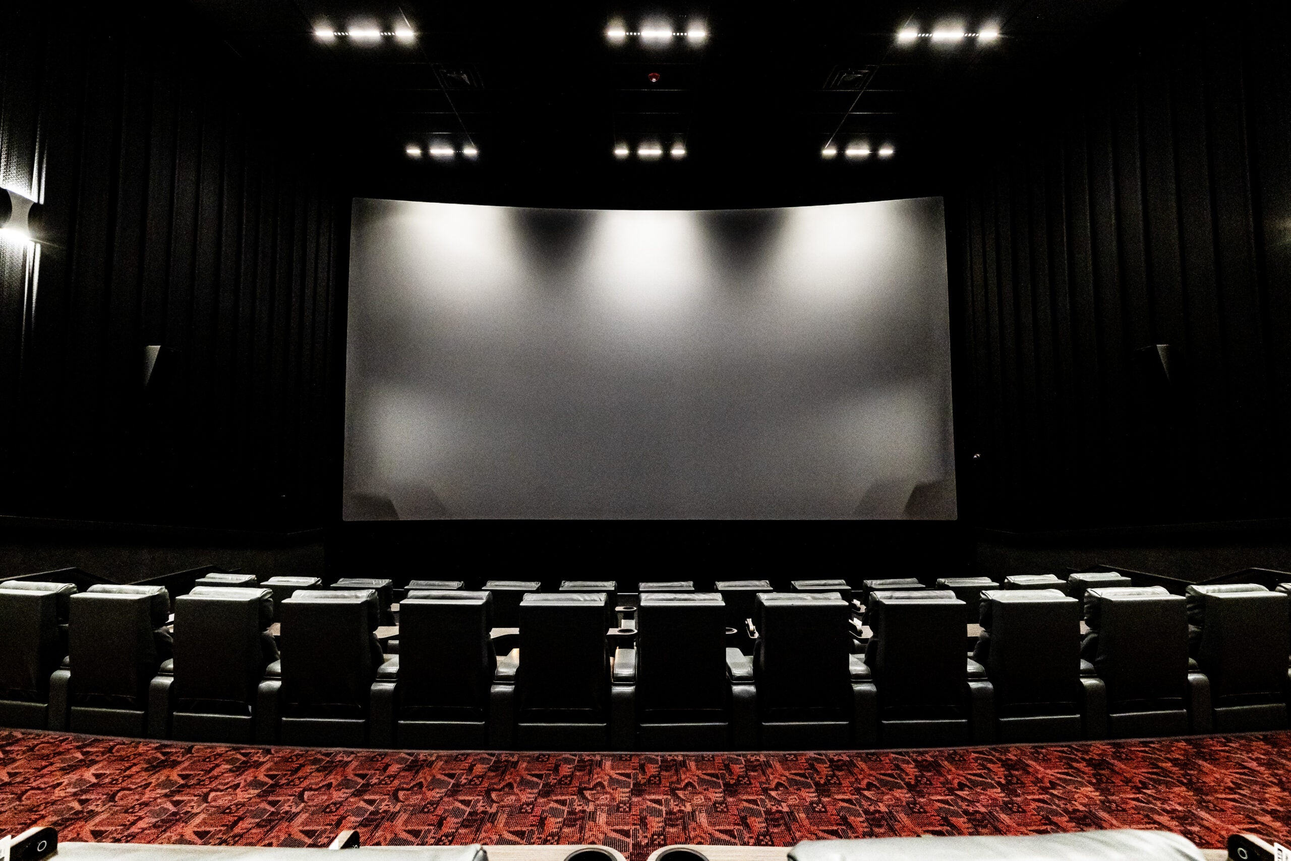 Inside a theater at Alamo Drafthouse Boston in the Seaport.