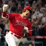FILE - Los Angeles Angels' Shohei Ohtani celebrates as he rounds first after hitting a two-run home run during the seventh inning of a baseball game against the New York Yankees Monday, July 17, 2023, in Anaheim, Calif. Shohei Ohtani is a favorite to win his second AL Most Valuable Player award, Thursday, Nov. 16, 2023.