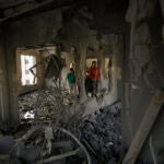 Palestinians look at the apartment of Khaled Kharousha that was destroyed by the Israeli military in Nablus, West Bank.