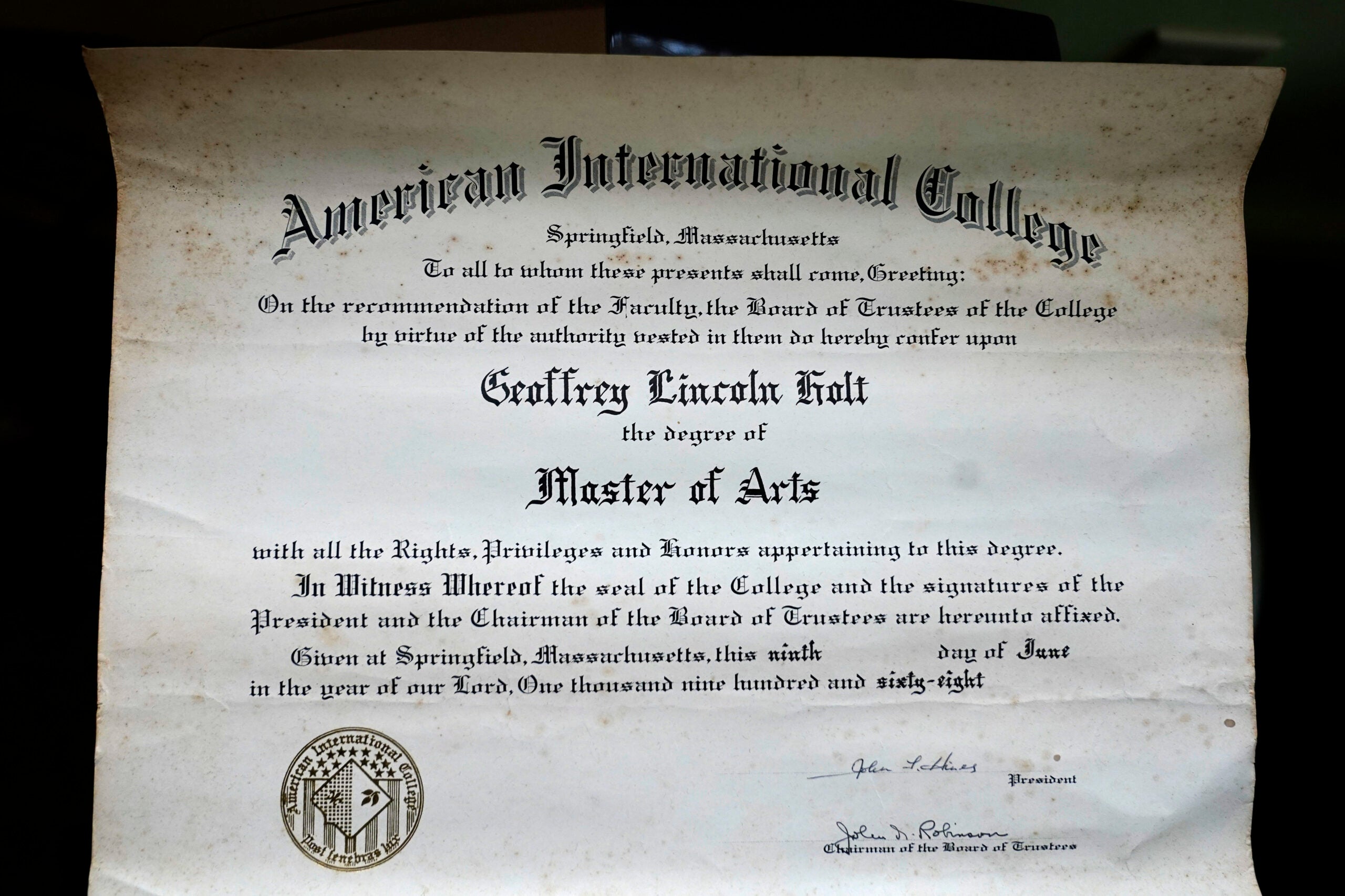 Geoffrey Holt's diploma for earning a Master's degree from American International College.