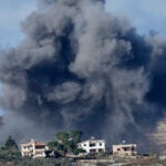 Black smoke rises from an Israeli airstrike on the outskirts of Aita al-Shaab.