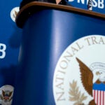 The National Transportation Safety Board logo and signage are seen at a news conference at NTSB headquarters in Washington.