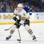 Boston Bruins defenseman Mason Lohrei (6) against the Tampa Bay Lightning during the third period of an NHL hockey game Monday, Nov. 20, 2023, in Tampa, Fla.