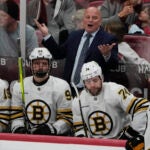 Bruins head coach Jim Montgomery reacts to a call during the first period.