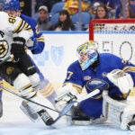 Buffalo Sabres goaltender Devon Levi makes a save on Boston Bruins right wing David Pastrnak during the second period.