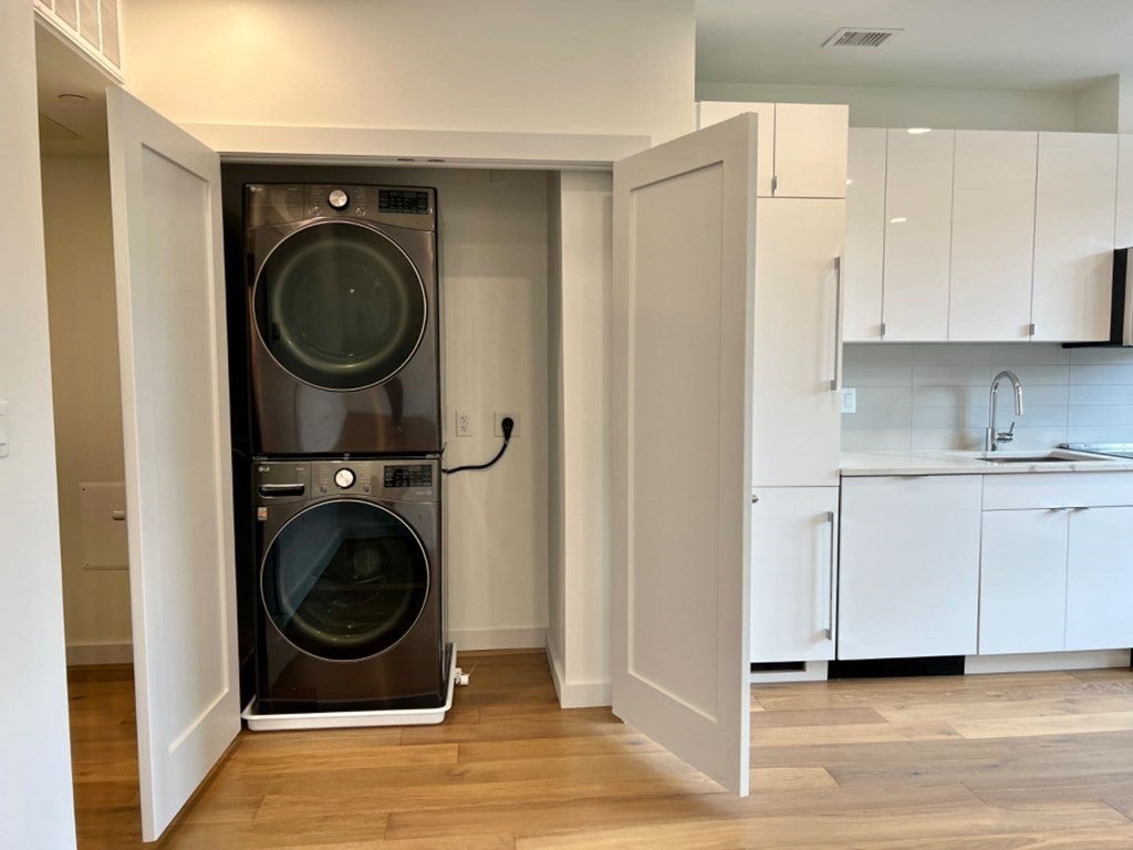 Stacked washer and dryer in Cambridge studio apartment