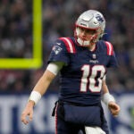 New England Patriots quarterback Mac Jones (10) looks out during an NFL football game between the New England Patriots and the Indianapolis Colts at Deutsche Bank Park Stadium in Frankfurt, Germany, Sunday, Nov. 12, 2023.
