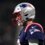 New England Patriots quarterback Mac Jones (10) looks on during an NFL football game between the New England Patriots and the Indianapolis Colts at Deutsche Bank Park Stadium in Frankfurt, Germany, Sunday, Nov. 12, 2023.