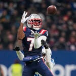 New England Patriots wide receiver JuJu Smith-Schuster (7) pulls in a pass against Indianapolis Colts cornerback Jaylon Jones in the second half of an NFL football game in Frankfurt, Germany Sunday, Nov. 12, 2023.