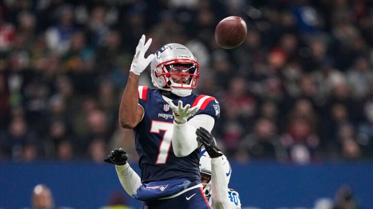 New England Patriots wide receiver JuJu Smith-Schuster (7) pulls in a pass against Indianapolis Colts cornerback Jaylon Jones in the second half of an NFL football game in Frankfurt, Germany Sunday, Nov. 12, 2023.