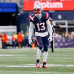 New England Patriots cornerback Jack Jones (13) drops into coverage during the first half of an NFL football game against the Washington Commanders on Sunday, Nov. 5, 2023, in Foxborough, Mass.
