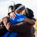 Sheneen McClain, right, mother of Elijah McClain, and friend and supporter MiDian Holmes embrace.
