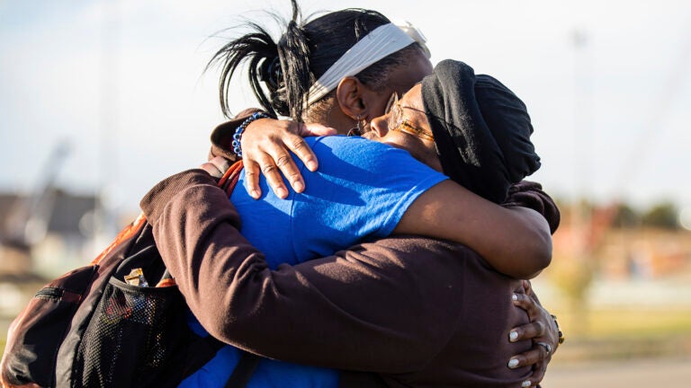 Sheneen McClain, right, mother of Elijah McClain, and friend and supporter MiDian Holmes embrace.
