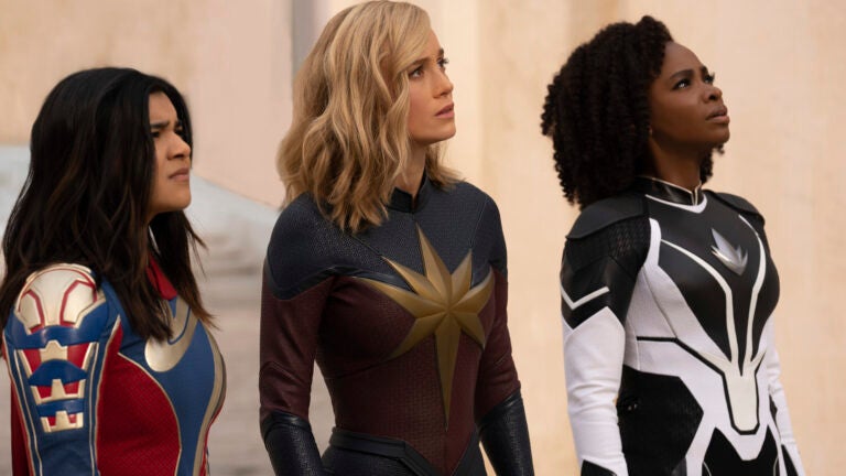This image released by Disney shows, from left, Iman Vellani as Ms. Marvel, Brie Larson as Captain Marvel, and Teyonah Parris as Captain Monica Rambeau in a scene from "The Marvels."