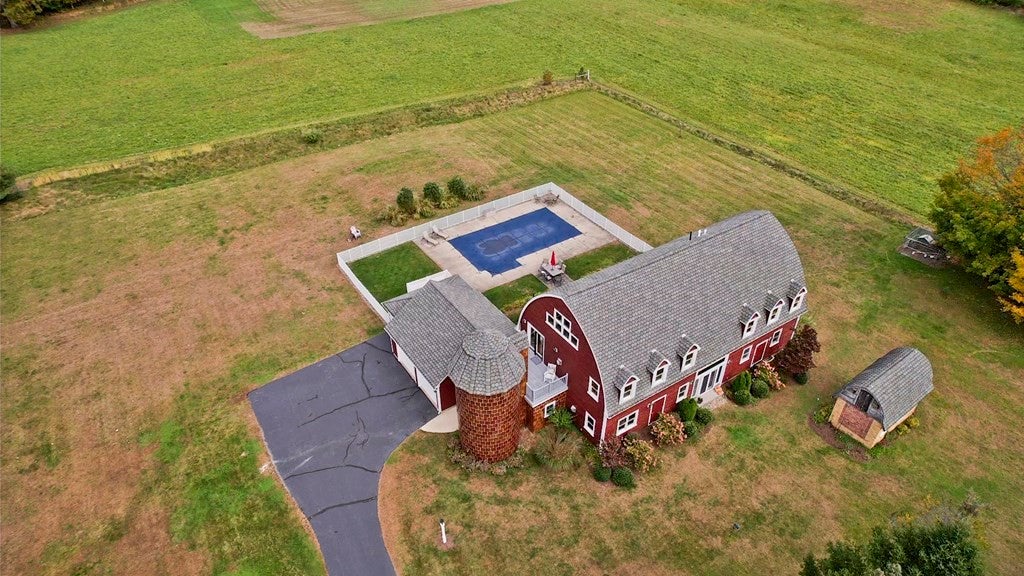 Overhead view of 236 Mill Rd in Hampden with over three acres of land and a swimming pool. 