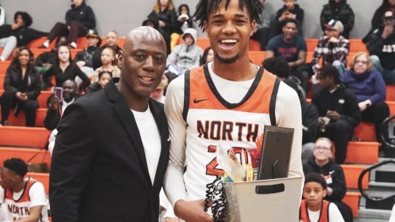 Carl-Hens Beliard, right, was photographed with Worcester North High School basketball coach Al Pettway.