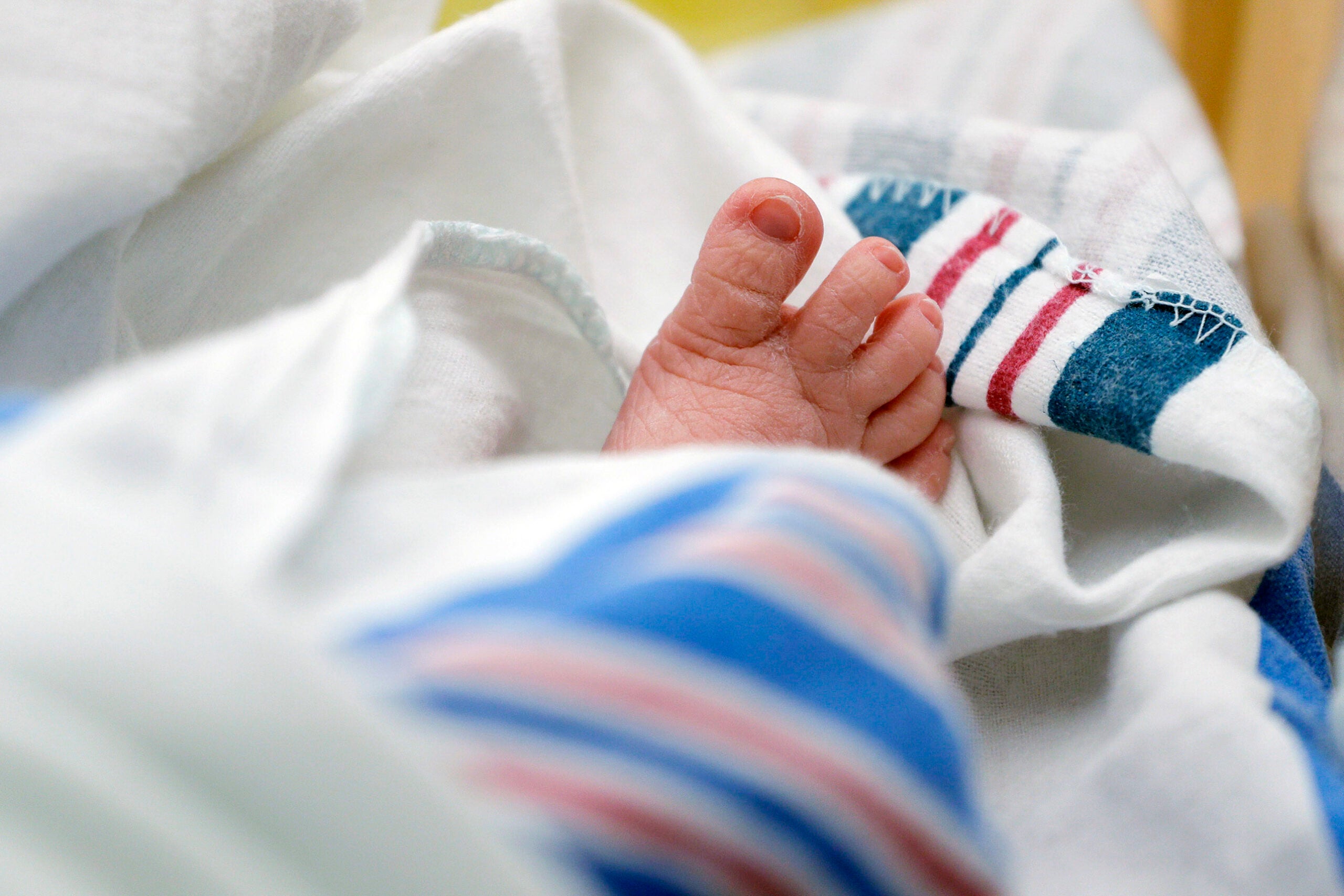The toes of a baby peek out of a blanket at a hospital in McAllen, Texas.