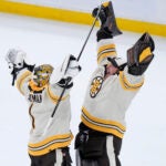 Boston Bruins goaltenders Jeremy Swayman, left, and Linus Ullmark, right, celebrate after they defeated the Toronto Maple Leafs in a shootout during an NHL hockey game, Thursday, Nov. 2, 2023, in Boston.