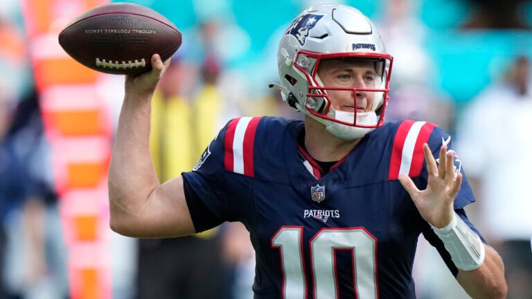 New England Patriots quarterback Mac Jones (10) prepares to pass during the first half of an NFL football game against the Miami Dolphins, Sunday, Oct. 29, 2023, in Miami Gardens, Fla.