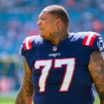 New England Patriots offensive lineman Trent Brown (77) walks on the field before the start of an NFL football game against the Miami Dolphins, Sunday, Oct. 29, 2023, in Miami Gardens, Fla.