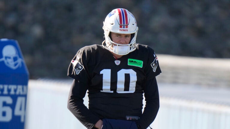 New England Patriots quarterback Mac Jones (10) warms up during an NFL football practice, Wednesday, Nov. 29, 2023, in Foxborough, Mass.