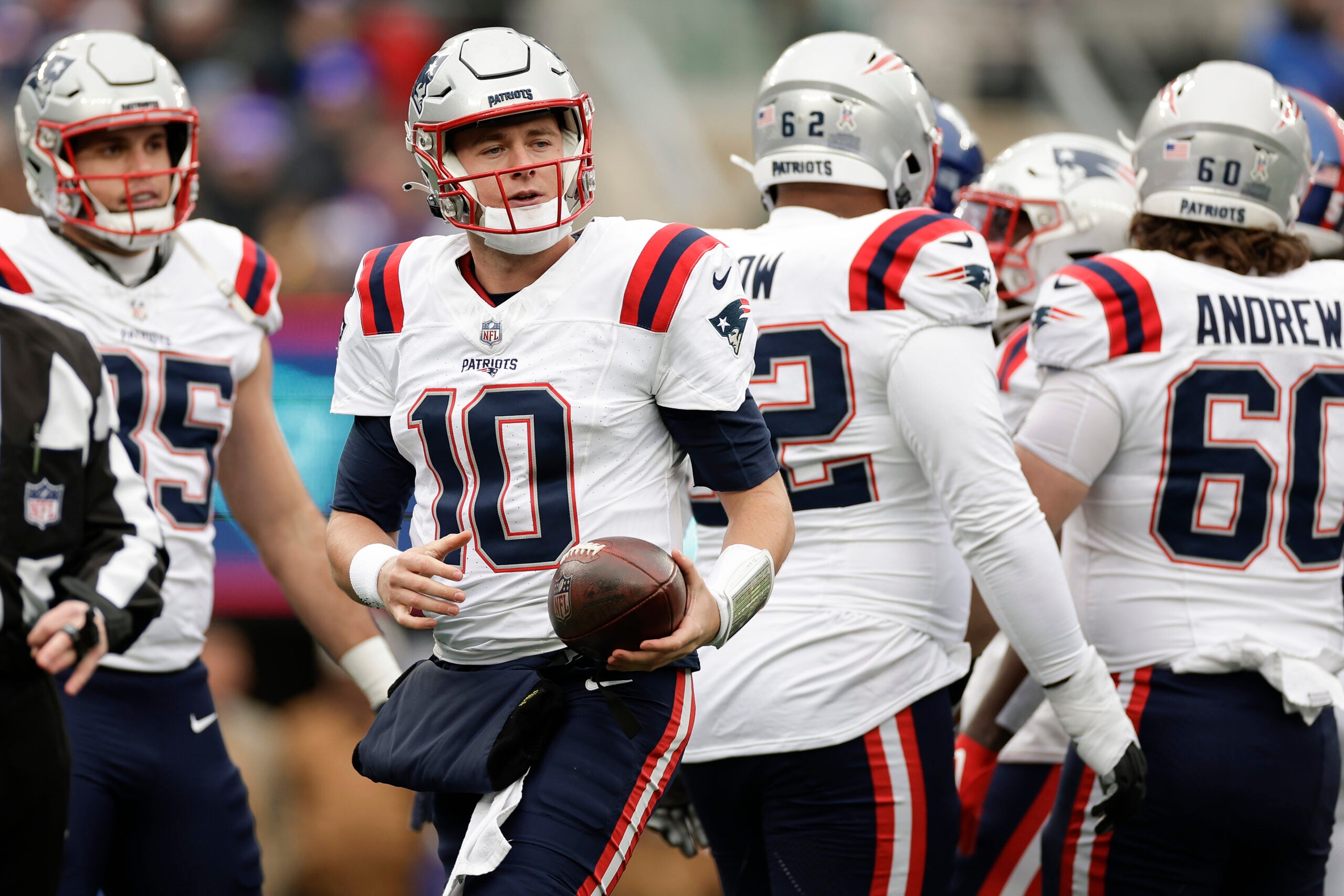 New England Patriots quarterback Mac Jones (10) walks back to the line of scrimmage after being sacked by the New York Giants during the first quarter of an NFL football game, Sunday, Nov. 26, 2023, in East Rutherford, N.J.