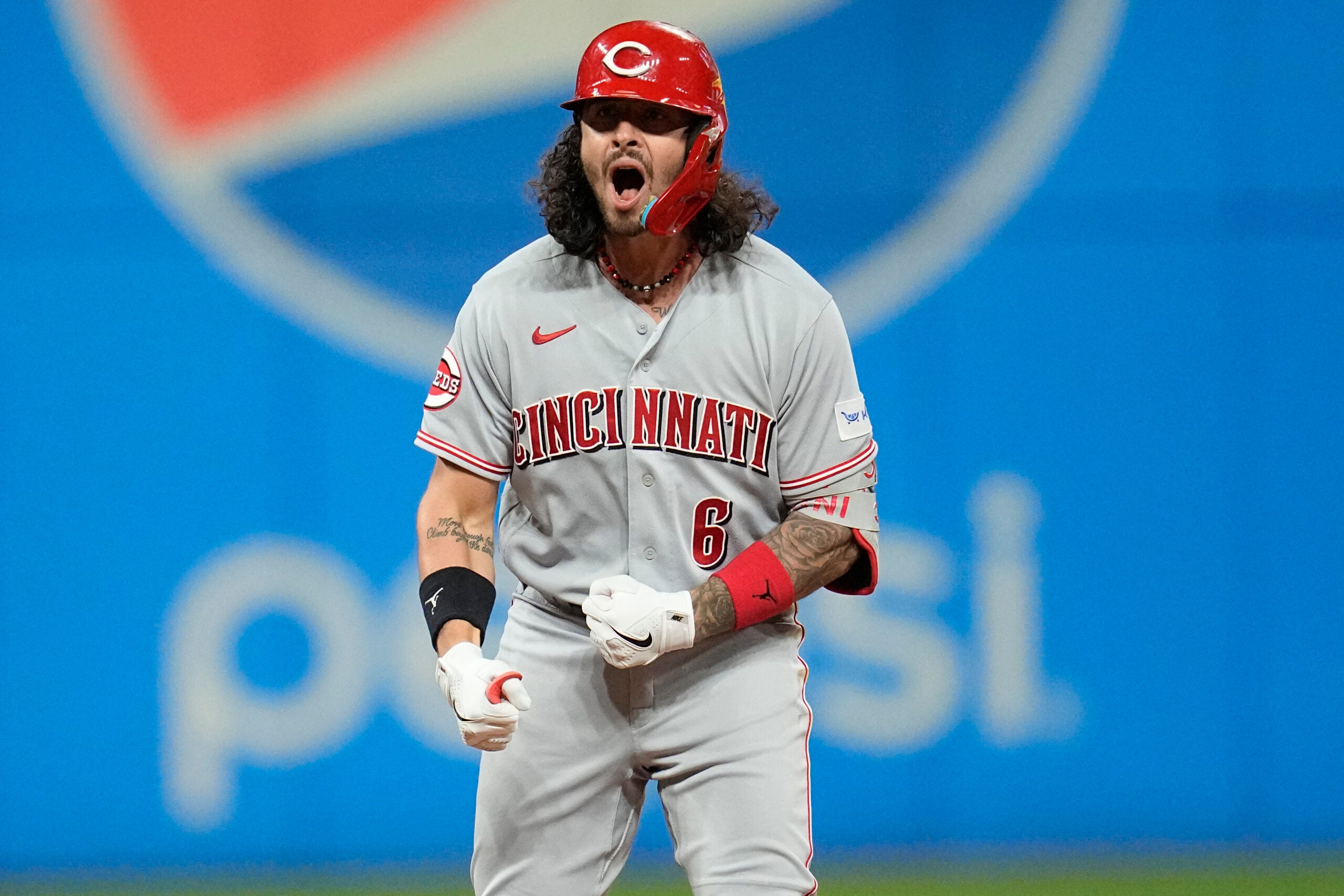Cincinnati Reds' Jonathan India celebrates his double against the Cleveland Guardians during the sixth inning of a baseball game Wednesday, Sept. 27, 2023, in Cleveland.