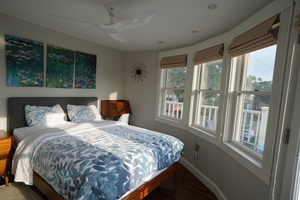 Bedroom with large windows. 