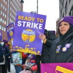 Janitors rally for a new contract in Cambridge, Mass.