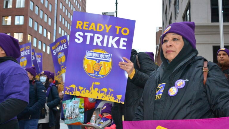 Janitors rally for a new contract in Cambridge, Mass.