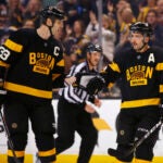 Boston Bruins' Patrice Bergeron is congratulated, after his goal, by defenseman Zdeno Chara (33) during the second period of an NHL hockey game against the Winnipeg Jets in Boston on Saturday, Nov. 19, 2016.