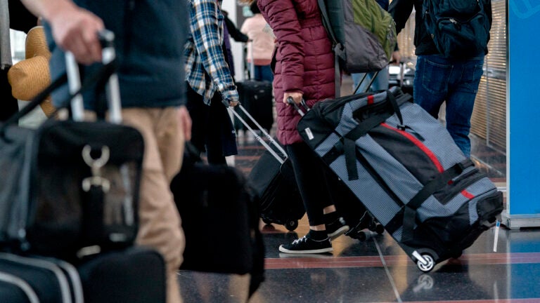 Travelers at Ronald Reagan Washington National Airport in Arlington, Va.