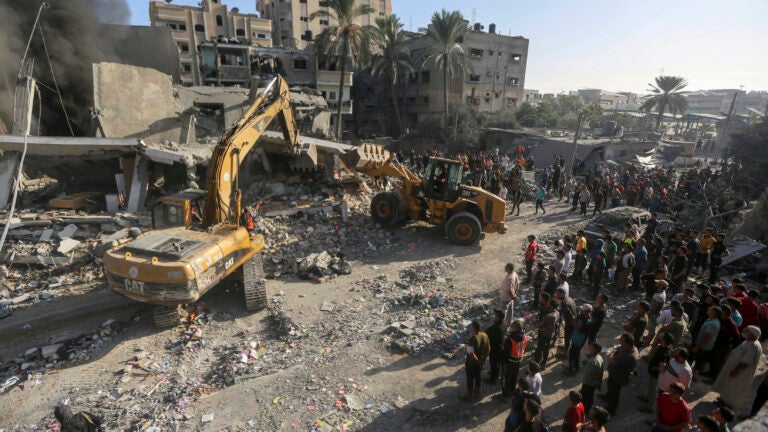 Heavy equipment is used to inspect the site of an Israeli strike in Khan Younis.
