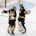 Boston Bruins starting goaltender Linus Ullmark (35) celebrates with his teammate goaltender Jeremy Swayman (1) after they defeated the Florida Panthers 4-3 during overtime period NHL action at TD Garden.