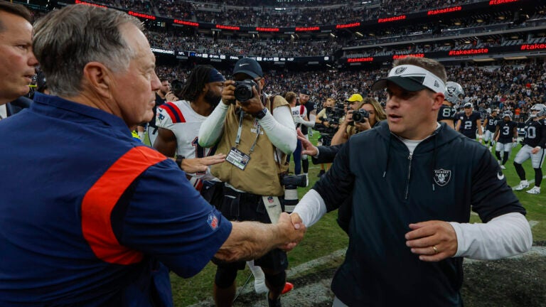 New England Patriots head coach Bill Belichick shaking hands with Las Vegas Raiders head coach Josh McDaniels after the Raiders defeated the Patriots 21-17 during NFL action at Allegiant Stadium.