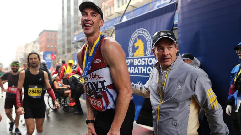 The Boston Marathon finish line-Former Bruins Zdeno Chara rests after crossing the finish line.