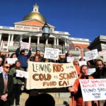 A rally was held in front of the Massachusetts State House to call for the Healey Administration to uphold the right to shelter, on Oct. 31, 2023.