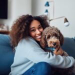 Women hugging her dog.