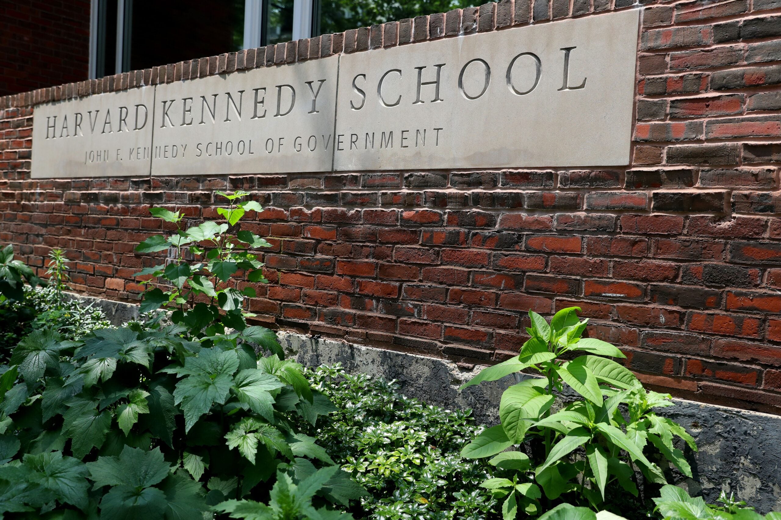 A view of a sign for the Harvard Kennedy School of Government in Cambridge, Massachusetts. 