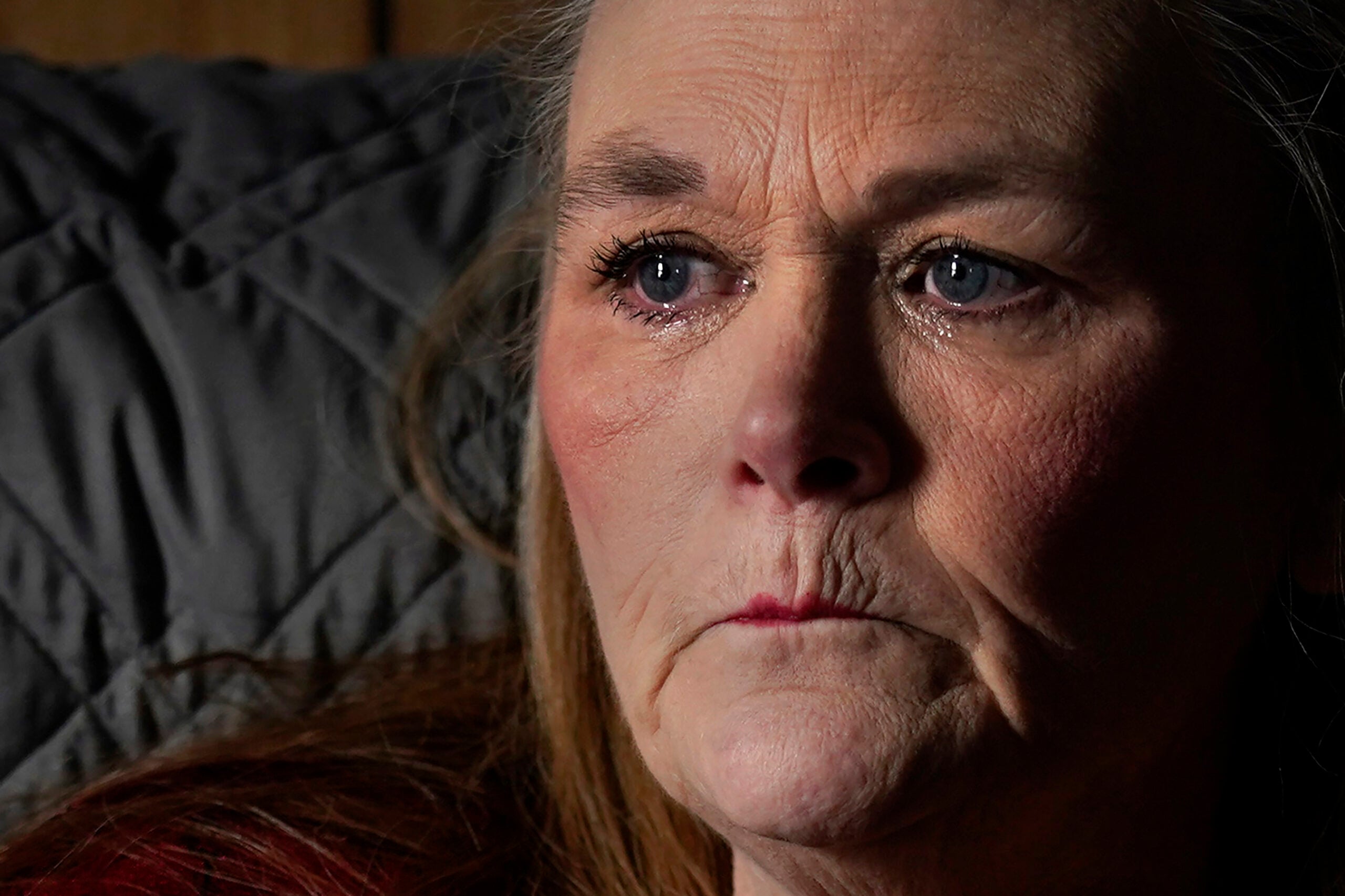 Tears fill the eyes of Trina Cotter while talking about her son, Zach Robinson. 