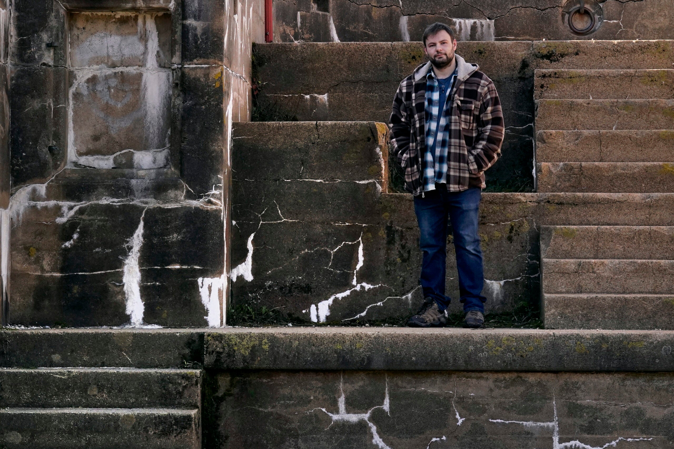 Jacob, an abuse survivor from New Hampshire’s youth detention center, stands for a portrait at Fort Foster. 