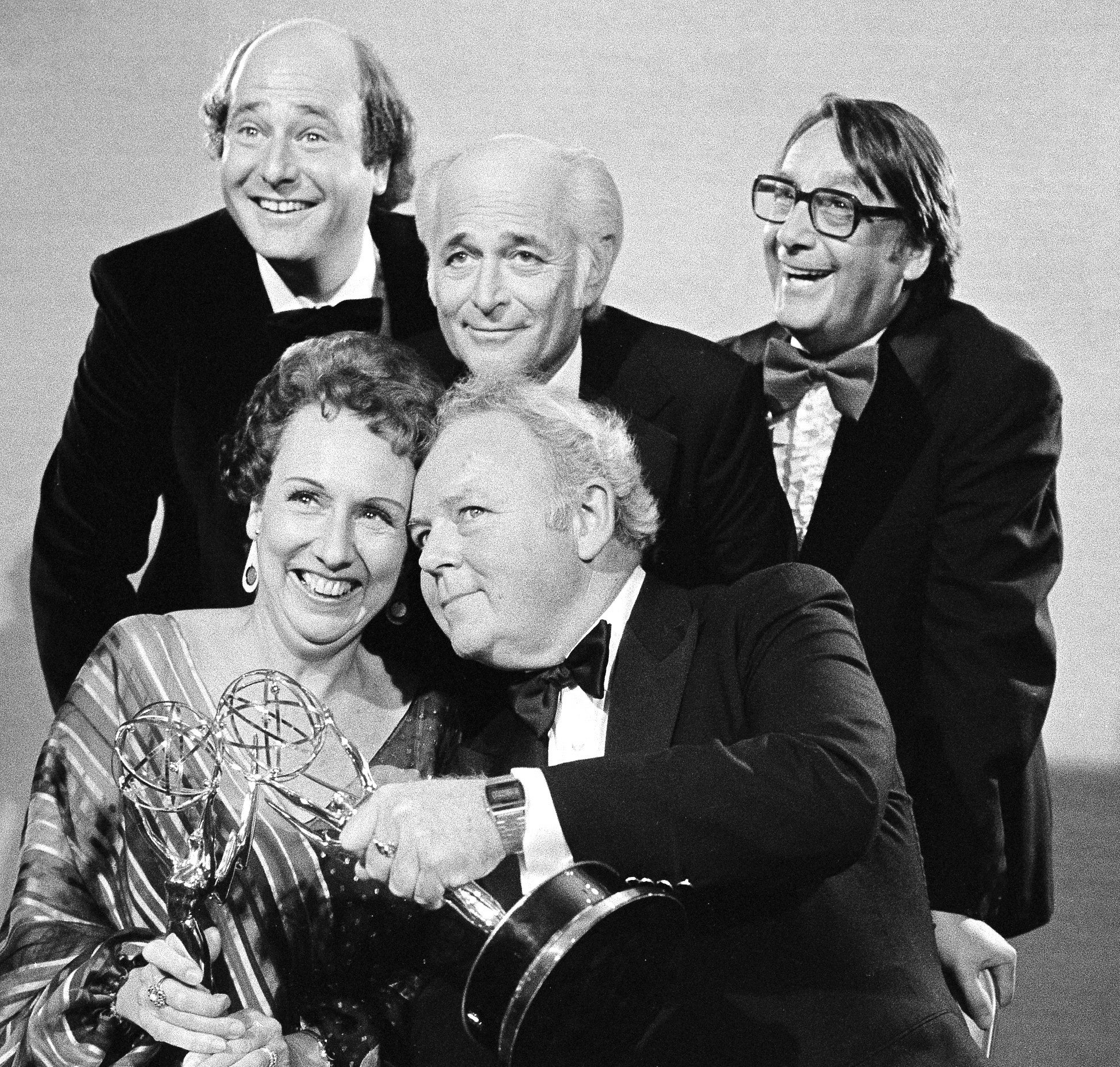 Actors Jean Stapleton, seated, left, and Carroll O'Connor, seated, right, from "All in the Family" hold their Emmys for outstanding lead actress and actor in a comedy series. 