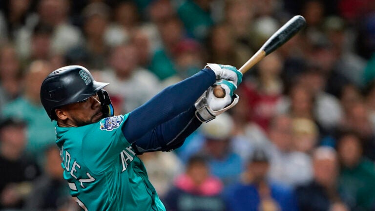 Seattle Mariners' Teoscar Hernandez follows through in a baseball game against the Los Angeles Angels, Tuesday, Sept. 12, 2023, in Seattle.