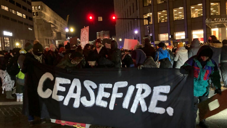 Protesters calling for an Israeli ceasefire in Gaza block an intersection in Boston.