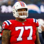 New England Patriots offensive tackle Trent Brown (77) reacts during the first half of an NFL football game against the Los Angeles Chargers on Sunday, Dec. 3, 2023, in Foxborough, Mass.