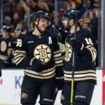 Boston Bruins' David Pastrnak (88) celebrates his goal agains the Philadelphia Flyers with Charlie McAvoy (73) and Pavel Zacha (18) during the first period of a preseason NHL hockey game Friday, Sept. 29, 2023, in Boston