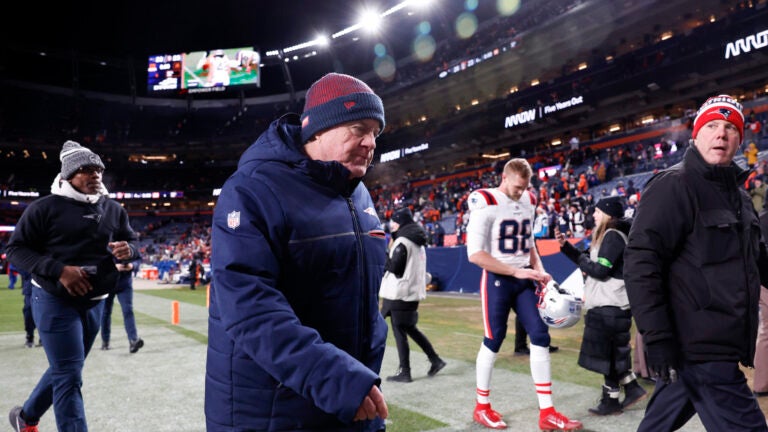 New England Patriots head coach Bill Belichick walks off the field after defeating the Denver Broncos, 26-23, at Empower Field at Mile High.