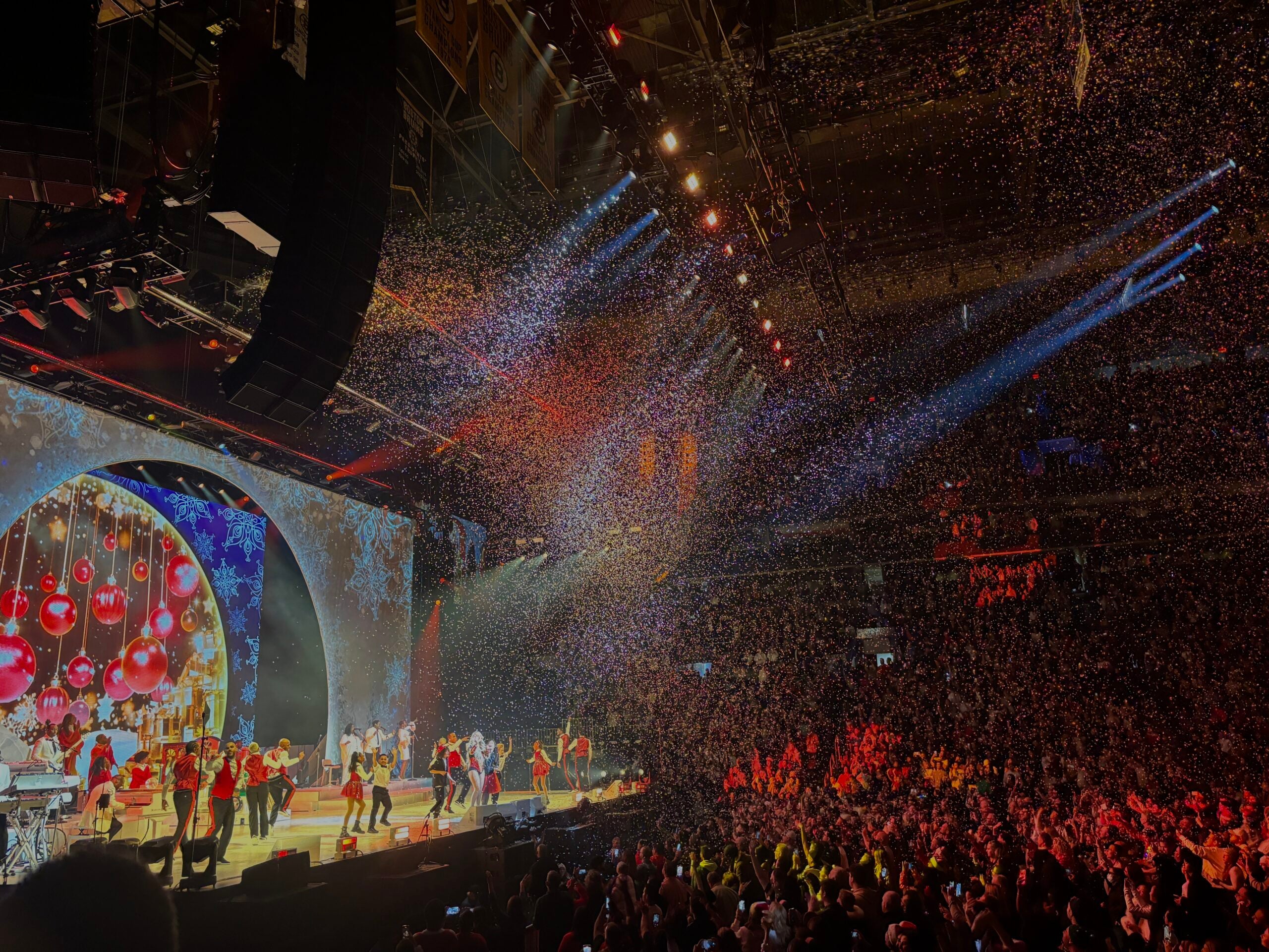 Confetti falls on the crowd during "All I Want For Christmas Is You" at TD Garden Monday, Dec. 11.