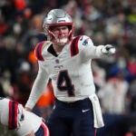 New England Patriots quarterback Bailey Zappe (4) against the Denver Broncos of an NFL football game Sunday December 24, 2023, in Denver.