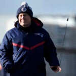 New England Patriots head coach Bill Belichick spins a whistle while watching players during an NFL football practice, Thursday, Dec. 14, 2023, in Foxborough, Mass.